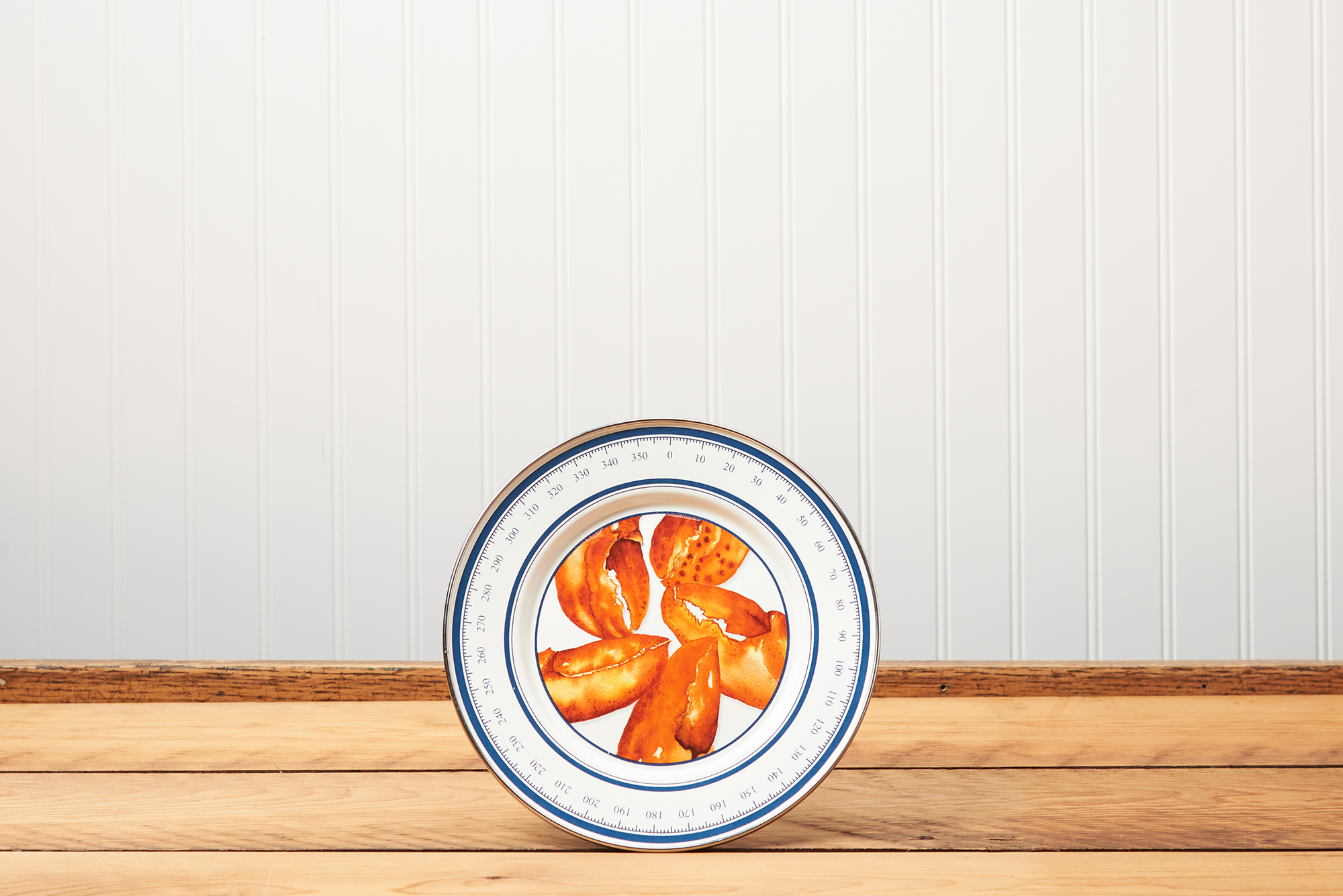 A Golden Rabbit Lobster Sandwich Plate sitting on a brown wooden table.