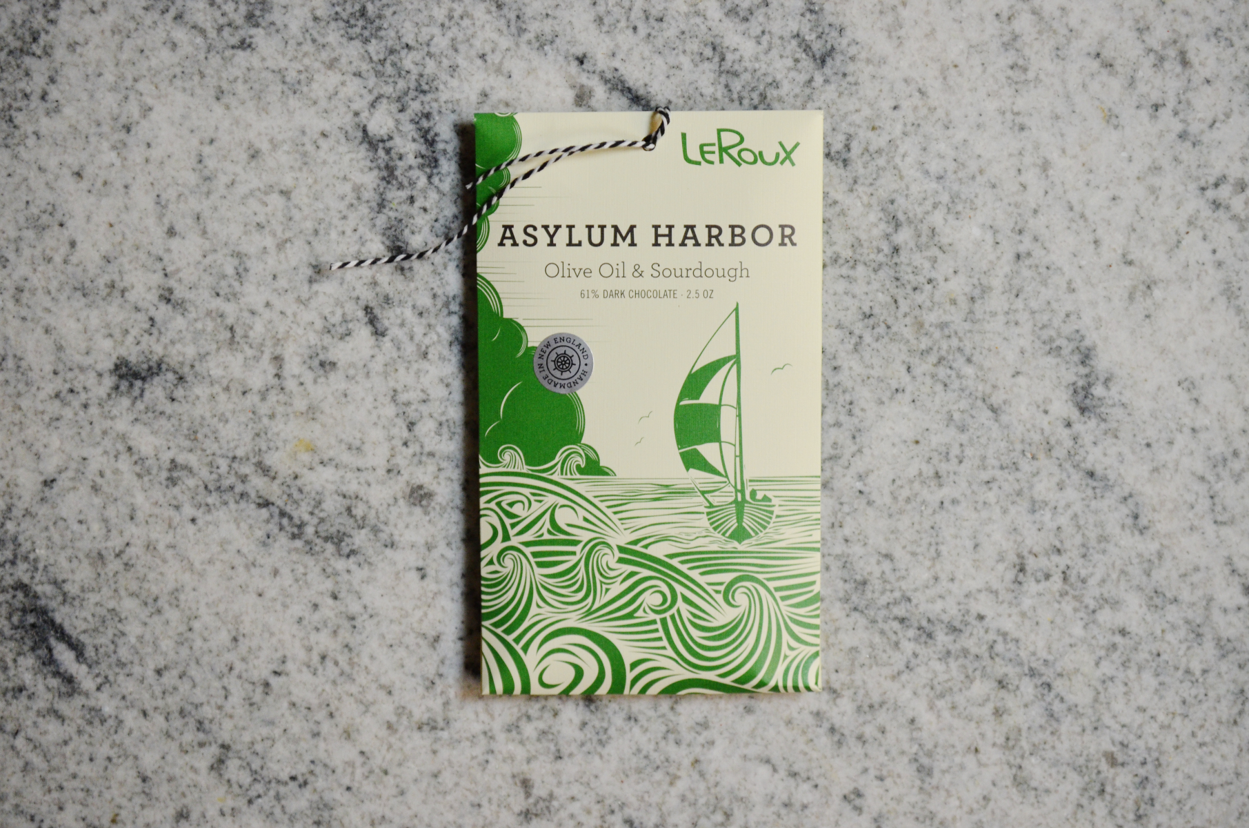 LeRoux Asylum Harbor Olive Oil & Sourdough dark chocolate bar on marble surface