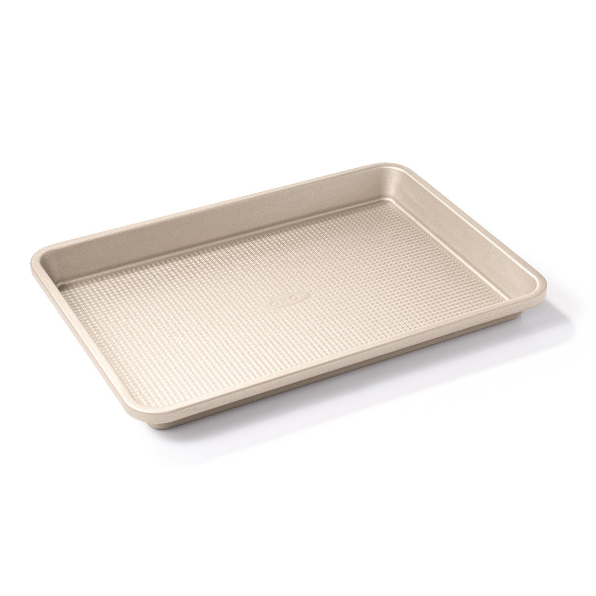 An OXO Jelly Roll Pan sits over a white background.