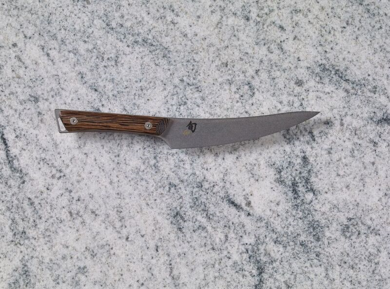A 6.5" Gokujo Boning/Fillet Knife on a marble countertop.