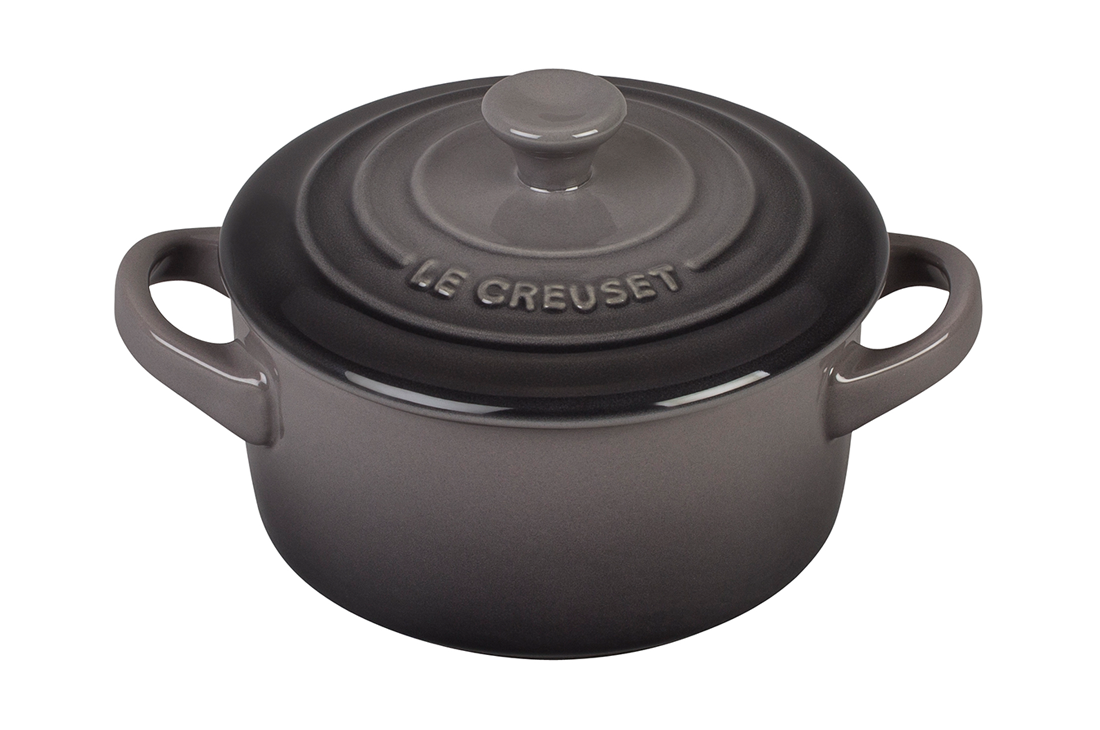 Le Creuset cast iron round casserole dish in matte black on white background