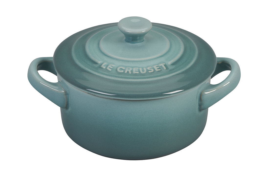 Blue Le Creuset cast iron Dutch oven on white background