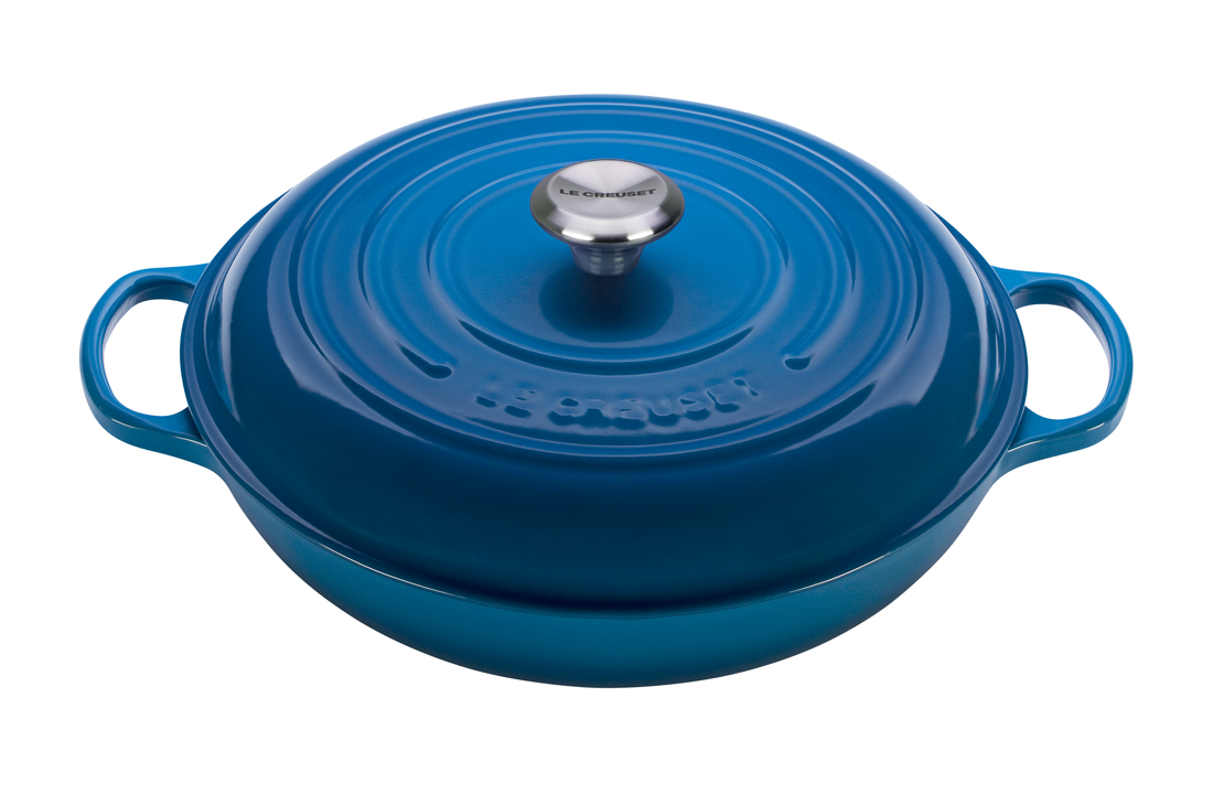 Blue cast iron Dutch oven with lid isolated on white background.