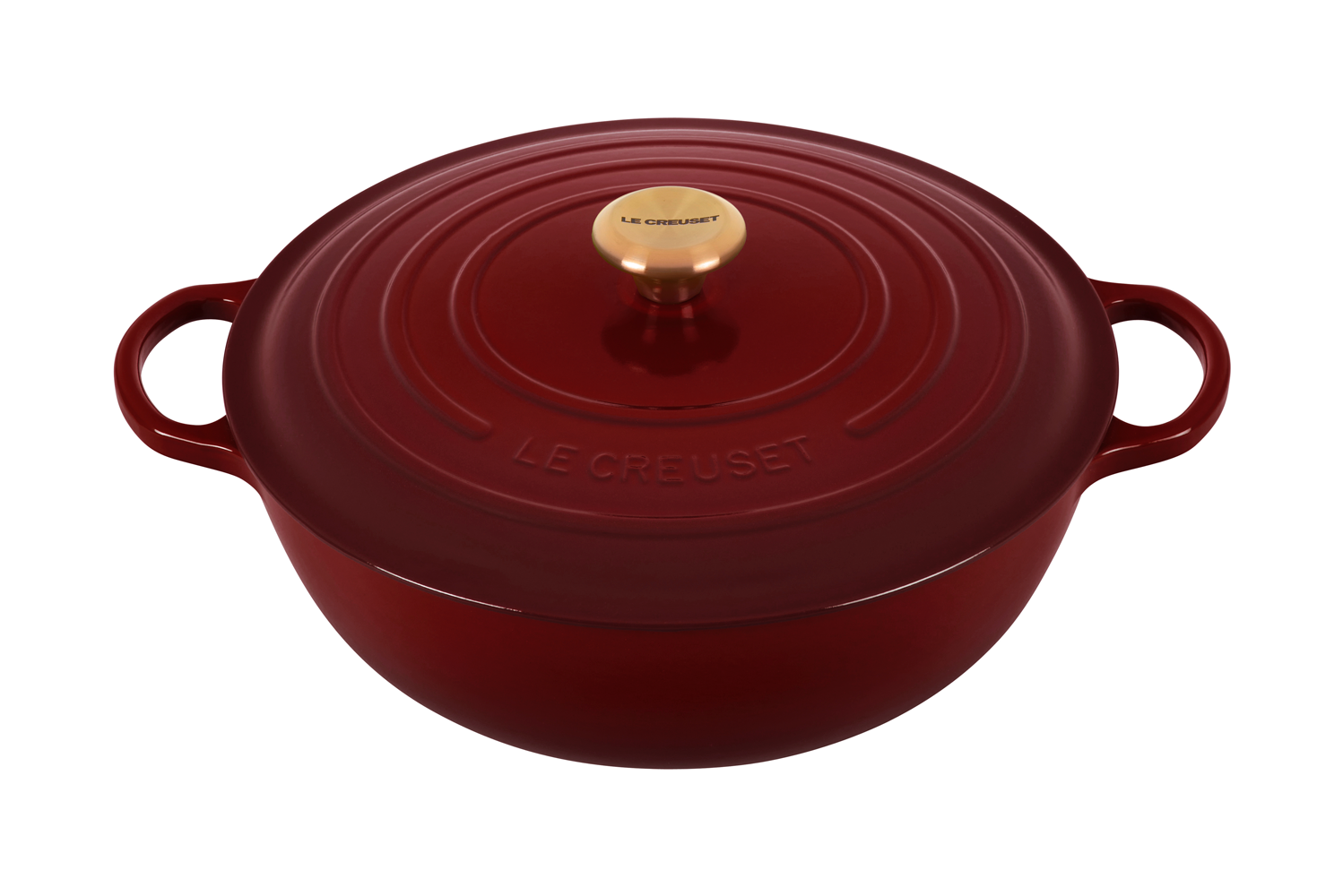 Red Le Creuset cast iron Dutch oven with lid on white background