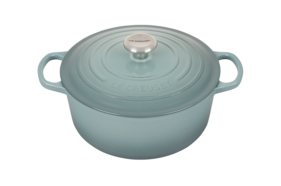 Le Creuset cast iron dutch oven in light blue on a white background