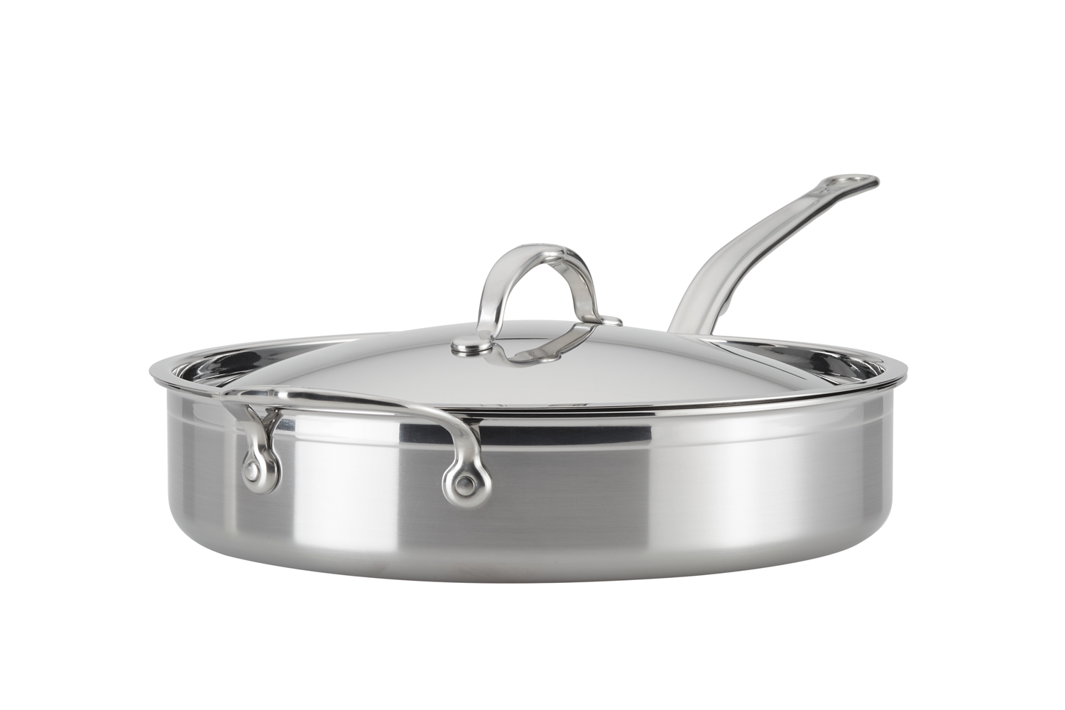 Stainless steel sauté pan with lid on white background