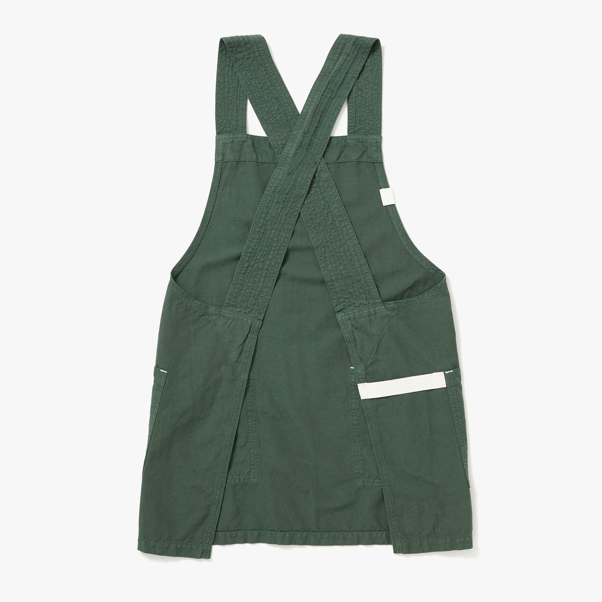 The reverse view of a Hedley & Bennett Broccolini green Smock over a white background.