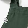 A close up shot of a Hedley & Bennett Broccolini green Smock.