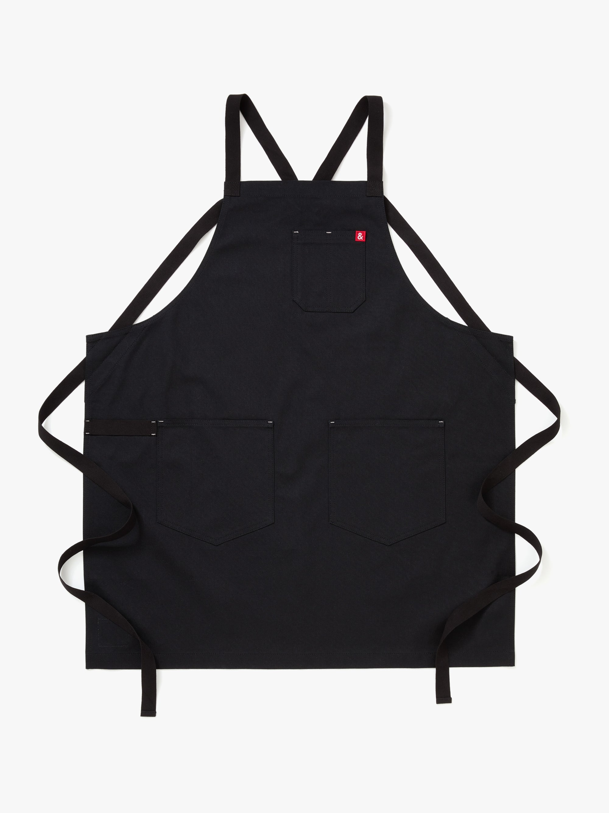 A Hedley & Bennett Caviar Black Crossback Apron over a white background.