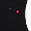 A close up shot of a Hedley & Bennett Caviar Black Crossback Apron.