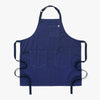 A Hedley & Bennett French Blue Essential Apron over a white background.