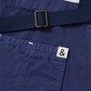 A close up shot of a Hedley & Bennett French Blue Essential Apron.