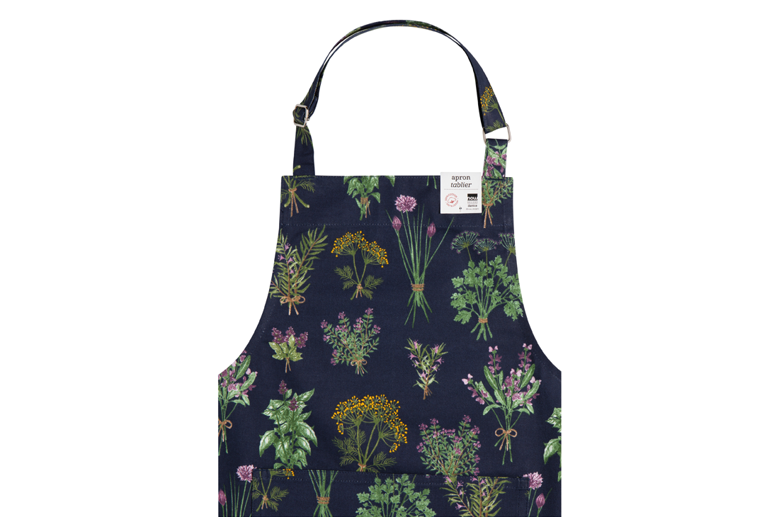 A Now Designs Fresh Herbs Apron over a white background.
