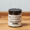 A jar of Gryffon Ridge Casco Bay Seasoning sits on a wooden tabletop.