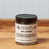 A jar of Gryffon Ridge Fire & Smoke sits on a wooden tabletop.