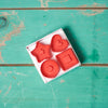 A King Arthur Baking Company Thumbprint Cookie Cutters, Set of 4 on a turquoise tabletop.