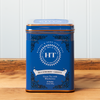 A tin of Harney & Sons Blueberry Green tea sits on a wooden countertop.