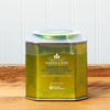 A tin of Harney & Sons Green Tea with Coconut tea sits on a wooden countertop.