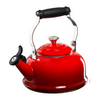 A Le Creuset Classic Kettle in Cherry over a white background.