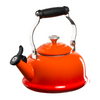 A Le Creuset Classic Kettle in Flame over a white background.