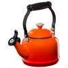 A Le Creuset Demi Kettle in Flame over a white background.