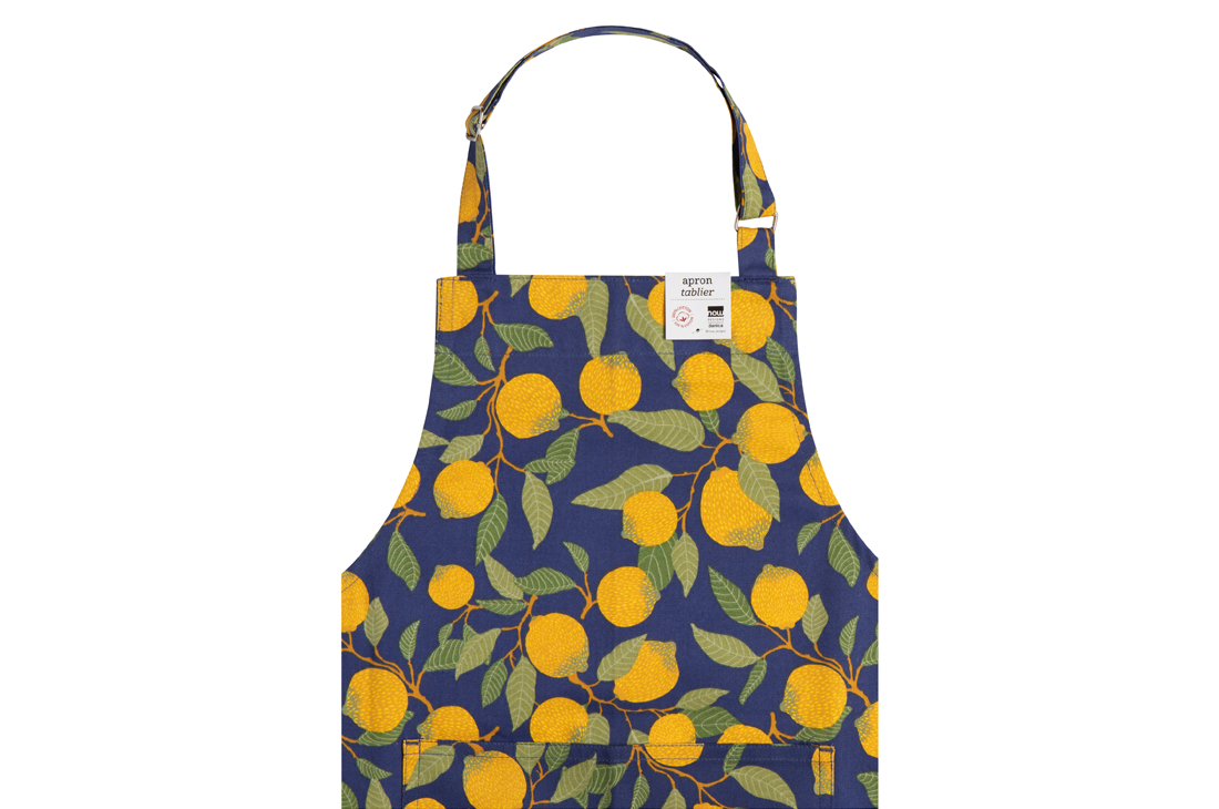 A Now Designs Lemons Apron over a white background.
