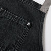 A close up shot of a Hedley & Bennett Oyster Denim Crossback Apron.