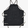 A Hedley & Bennett Oyster Denim Crossback Apron over a white background.