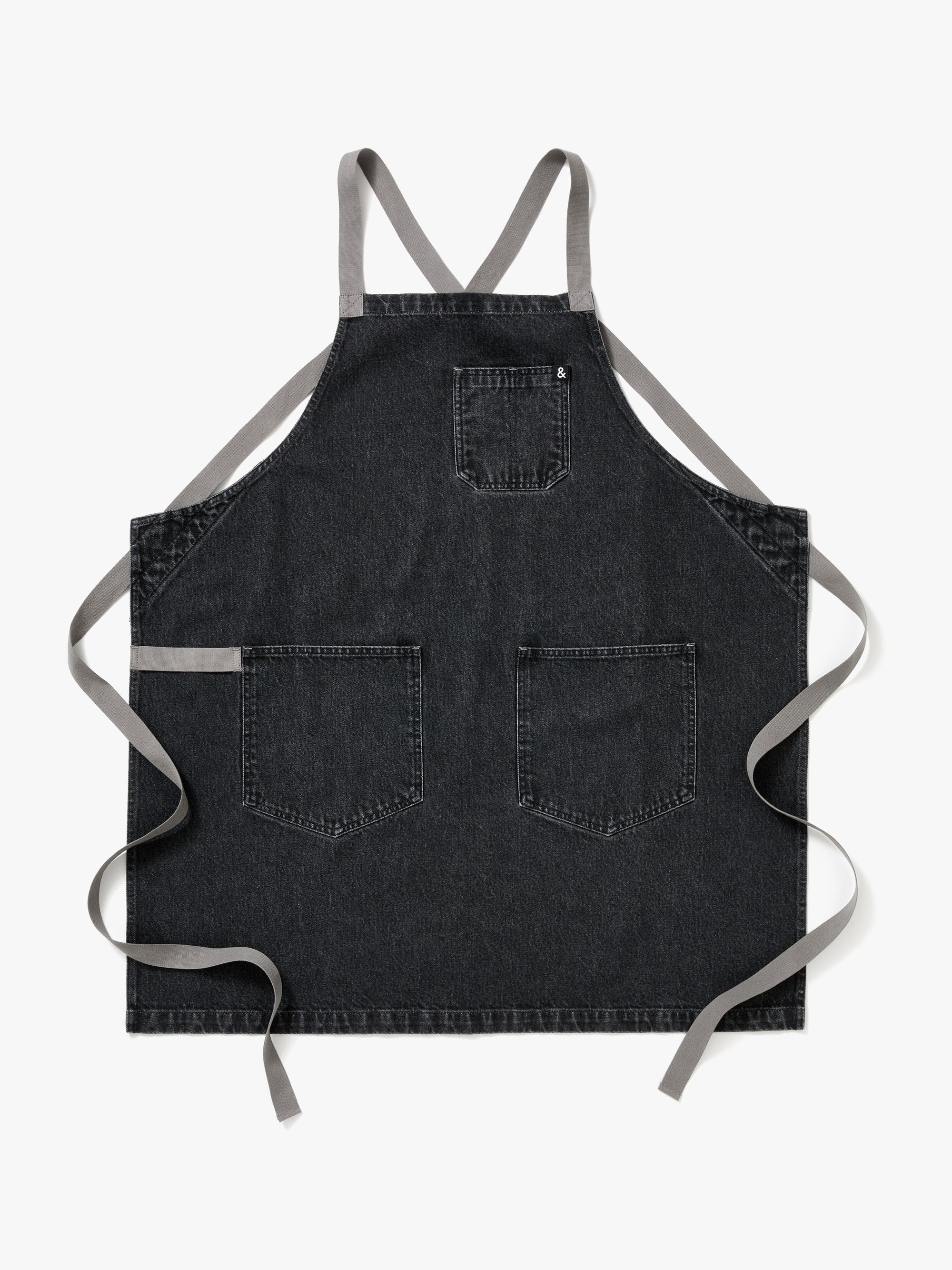 A Hedley & Bennett Oyster Denim Crossback Apron over a white background.
