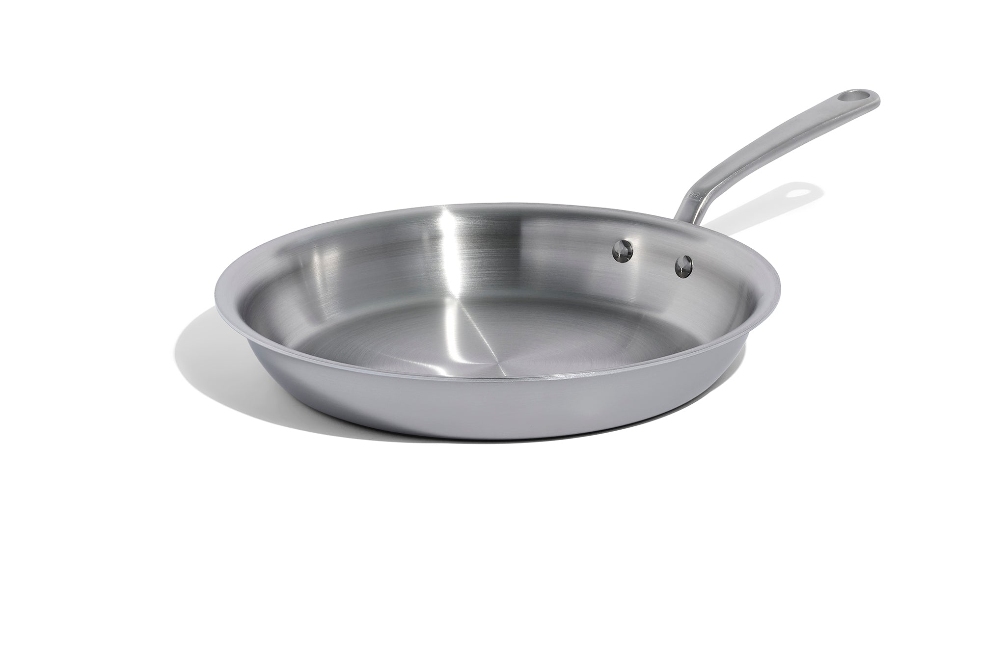 A 12 inch Made In Stainless Clad Frying Pan in front of a white background.