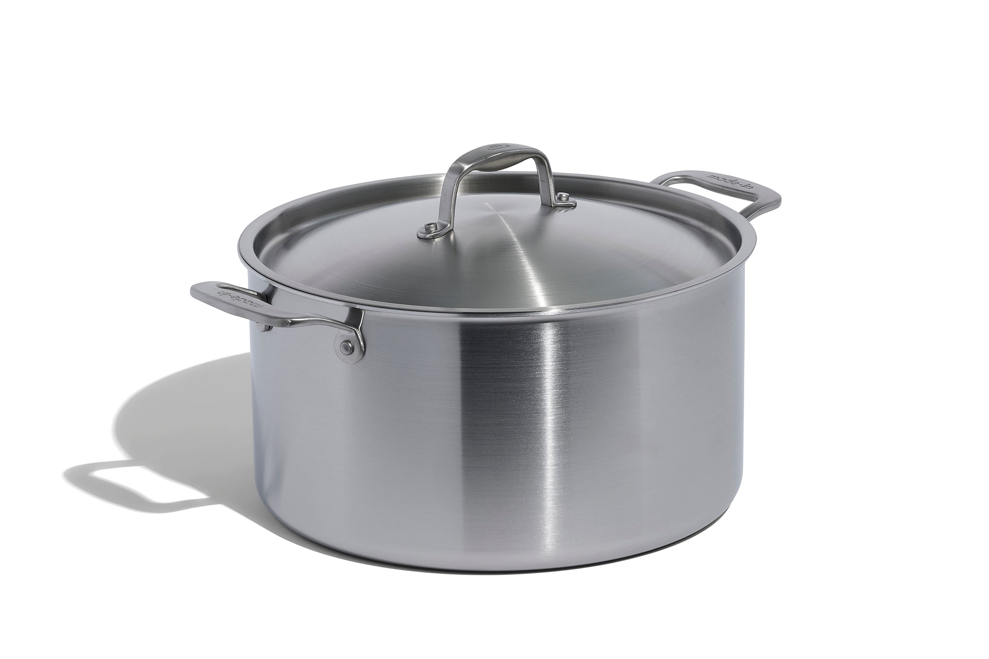 A Made In Stainless Clad Stock Pot in front of a white background.
