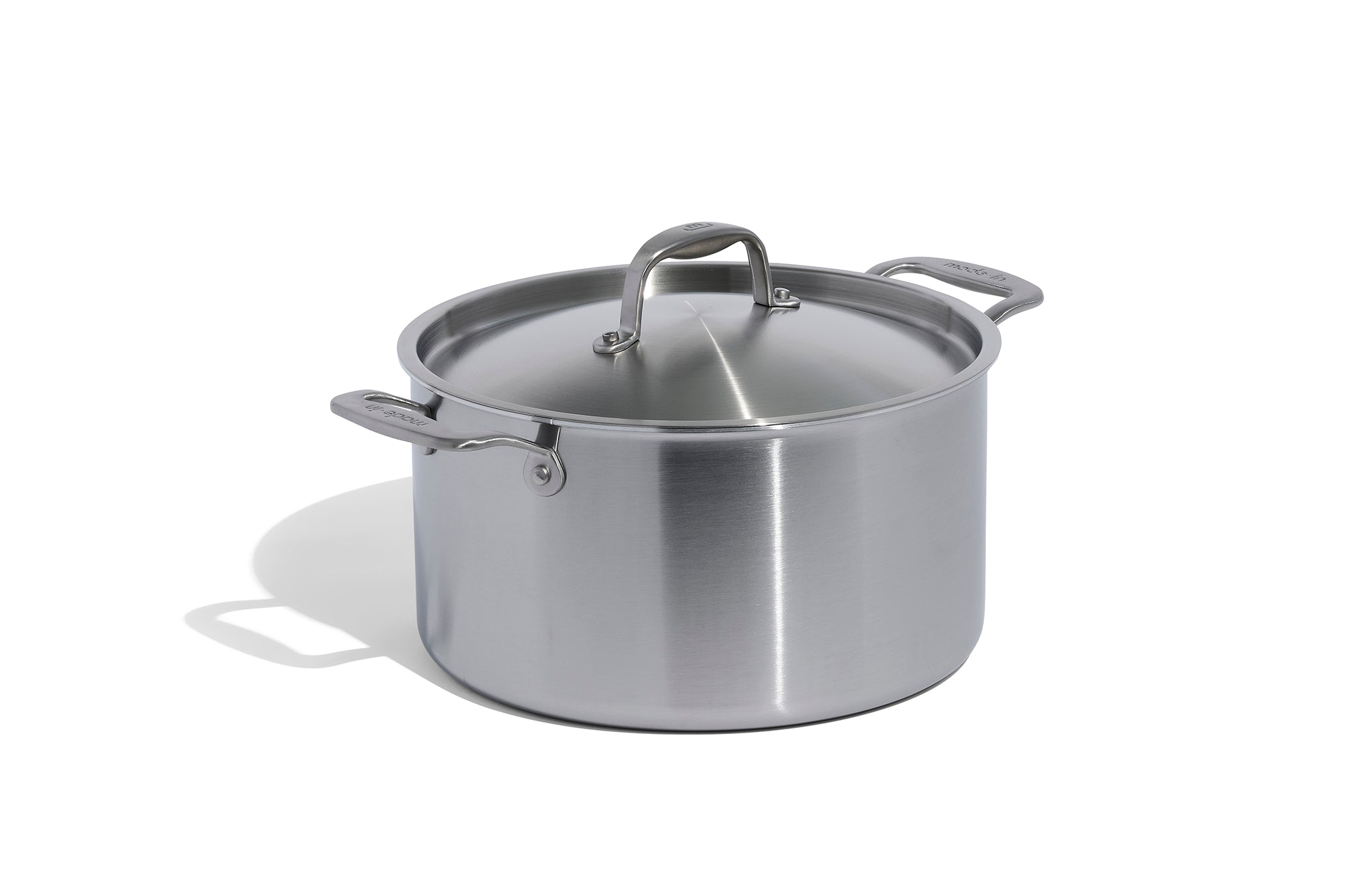 A Made In Stainless Clad Stock Pot in front of a white background.