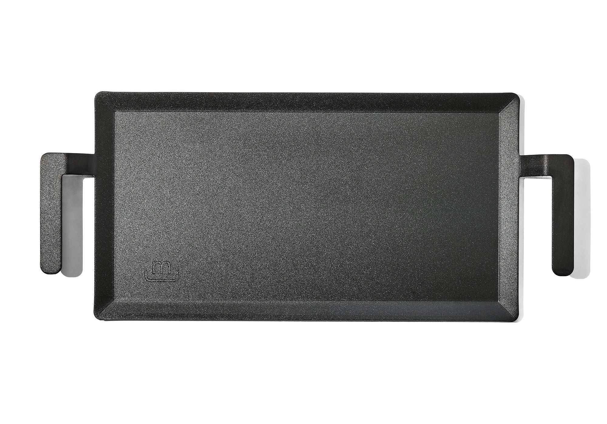 A Made In Seasoned Carbon Steel Griddle in front of a white background.