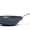 A Made In Seasoned Carbon Steel Wok in front of a white background.