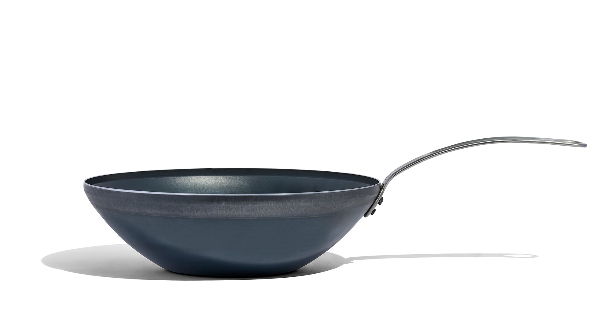 A Made In Seasoned Carbon Steel Wok in front of a white background.
