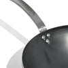 A close up of a Made In Seasoned Carbon Steel Wok in front of a white background.