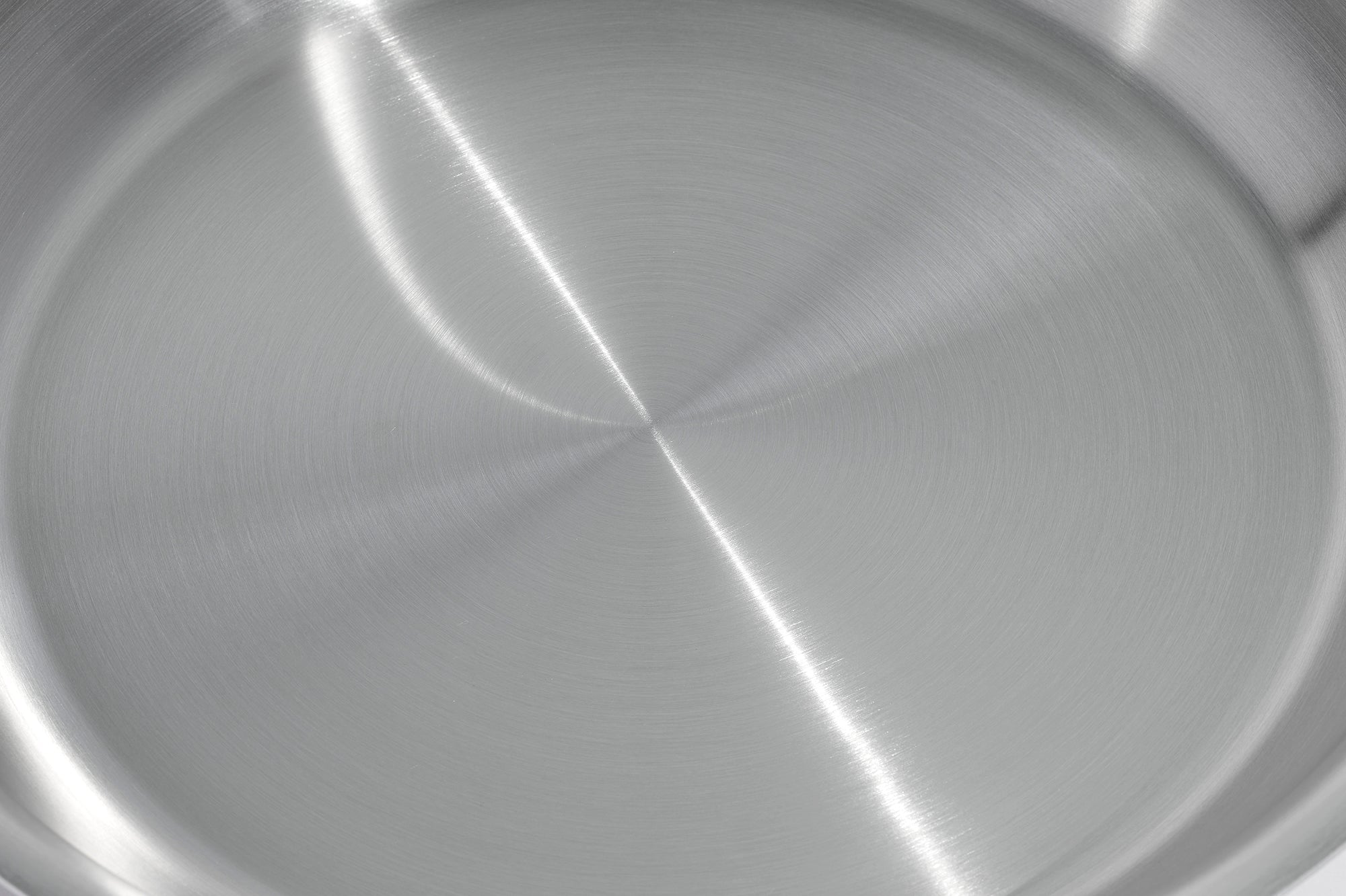 Close-up of a pan's stainless steel cooking surface.