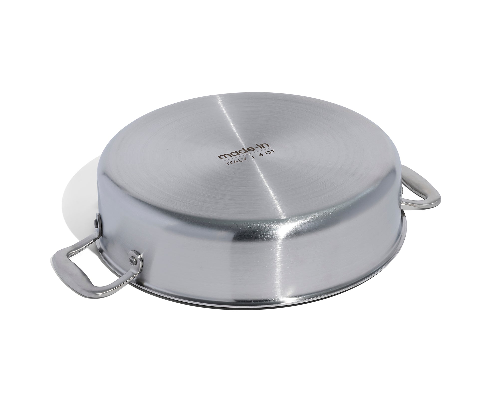 The underside of a Made In Stainless Clad Rondeau with Lid in front of a white background.