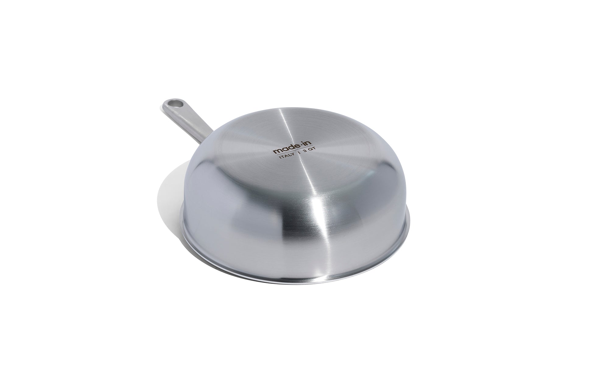 The underside of a Made In Stainless Clad Saucier in front of a white background.