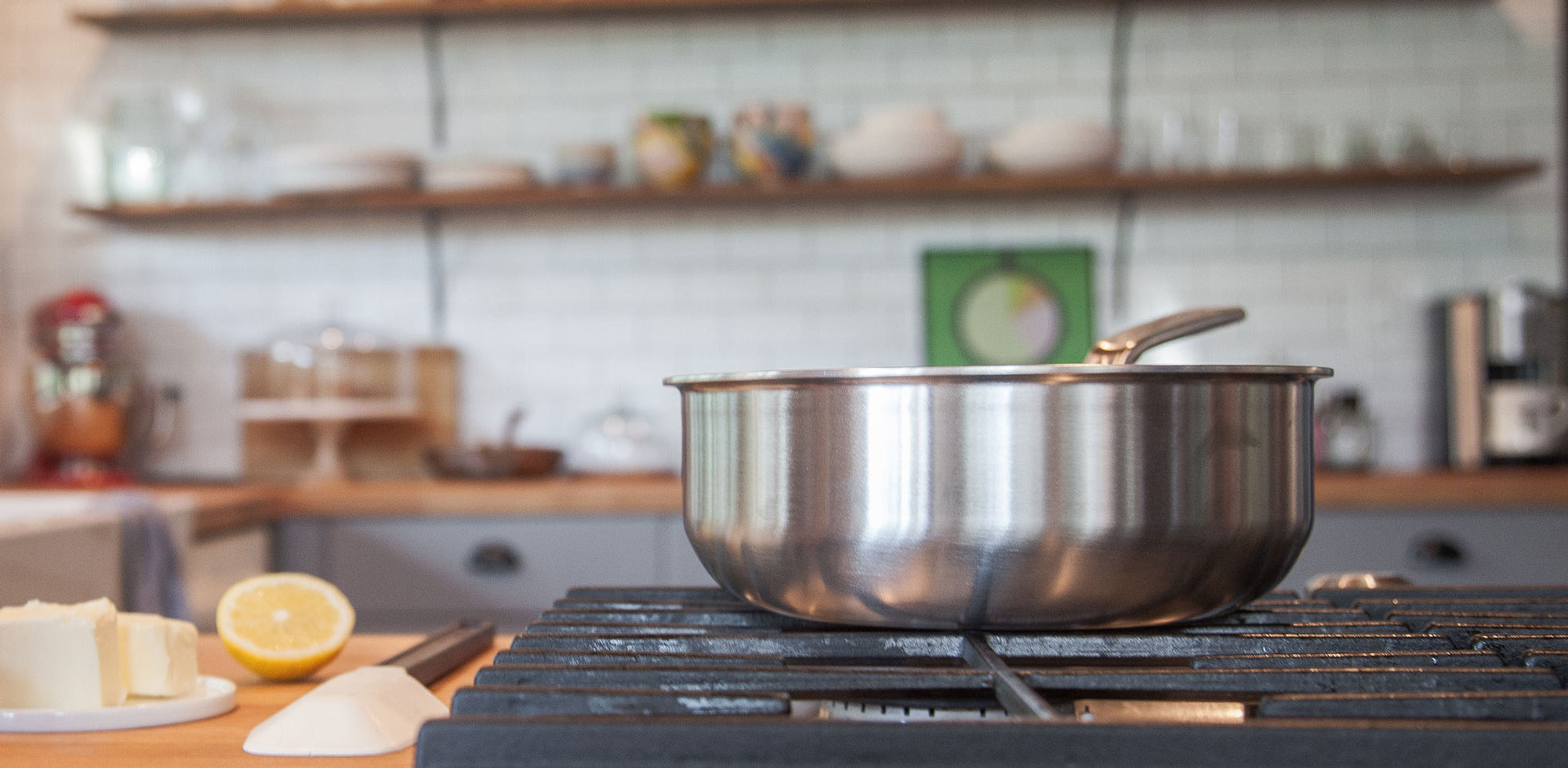 A Made In Stainless Clad Saucier sits on a stovetop.