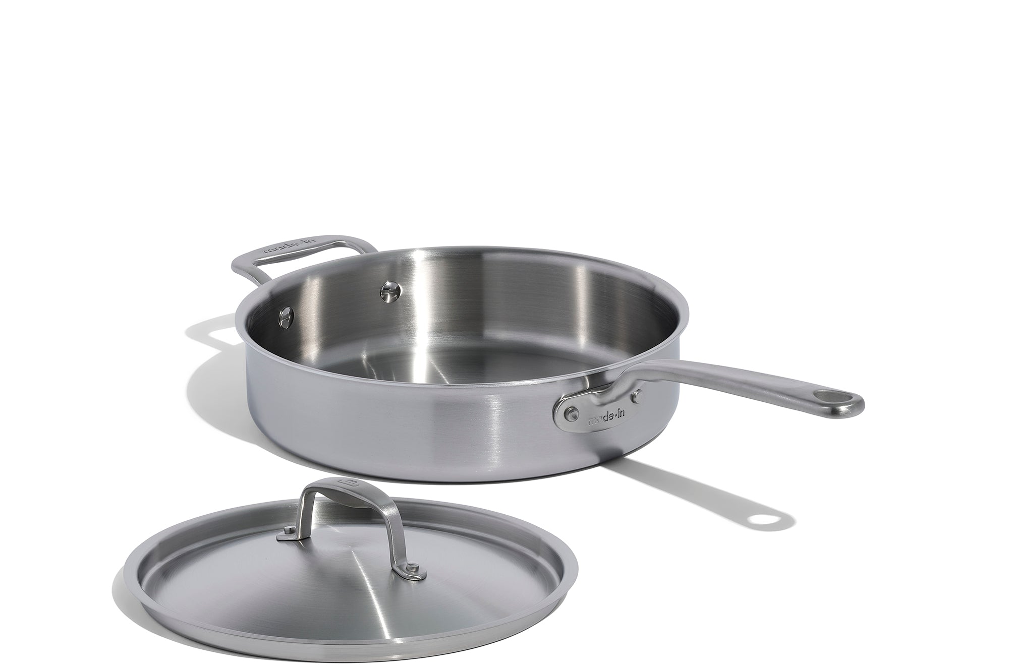 A Made In Stainless Clad Saute Pan with Lid in front of a white background.