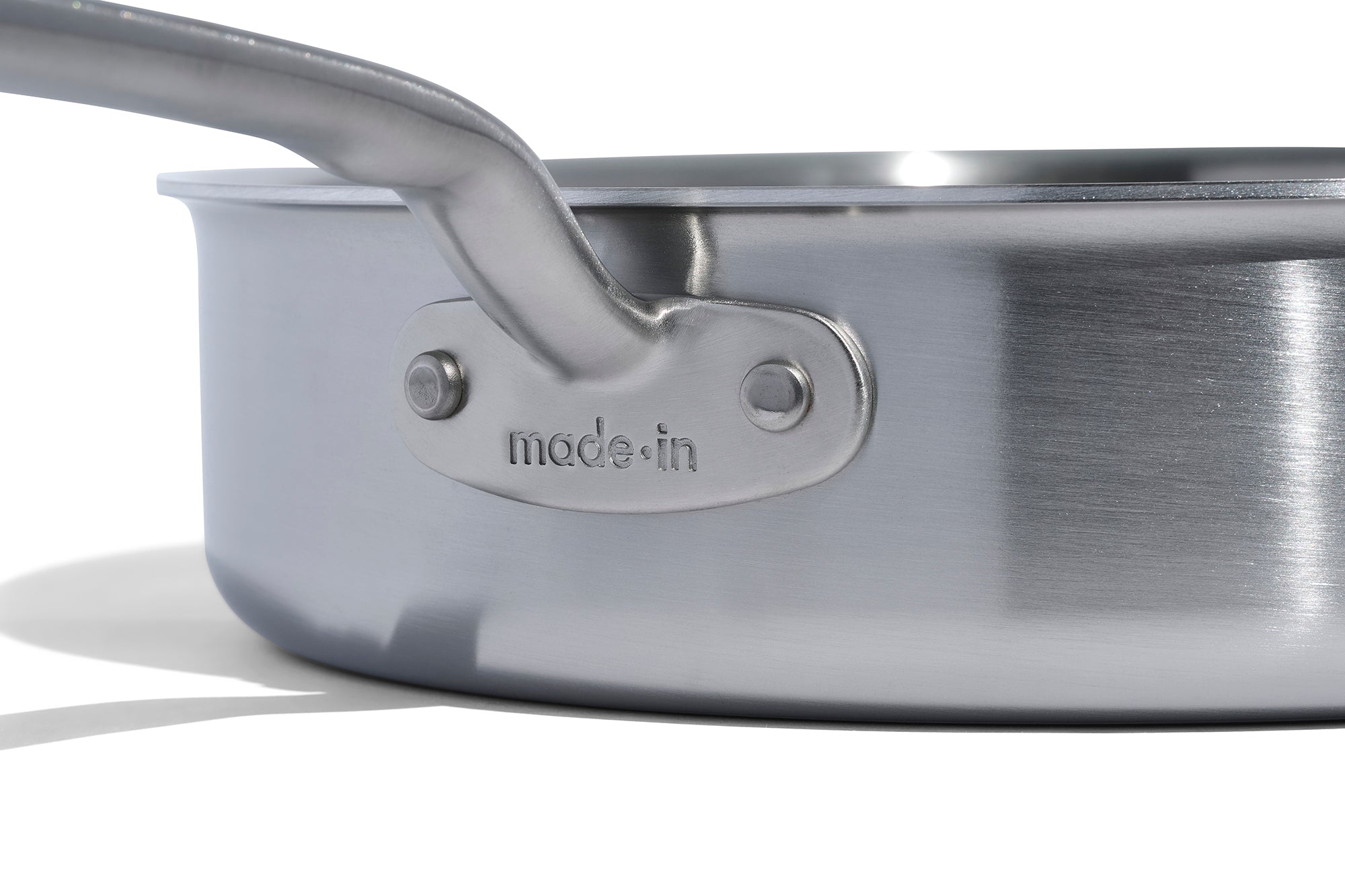 A close up of a Made In Stainless Clad Saute Pan with Lid in front of a white background.