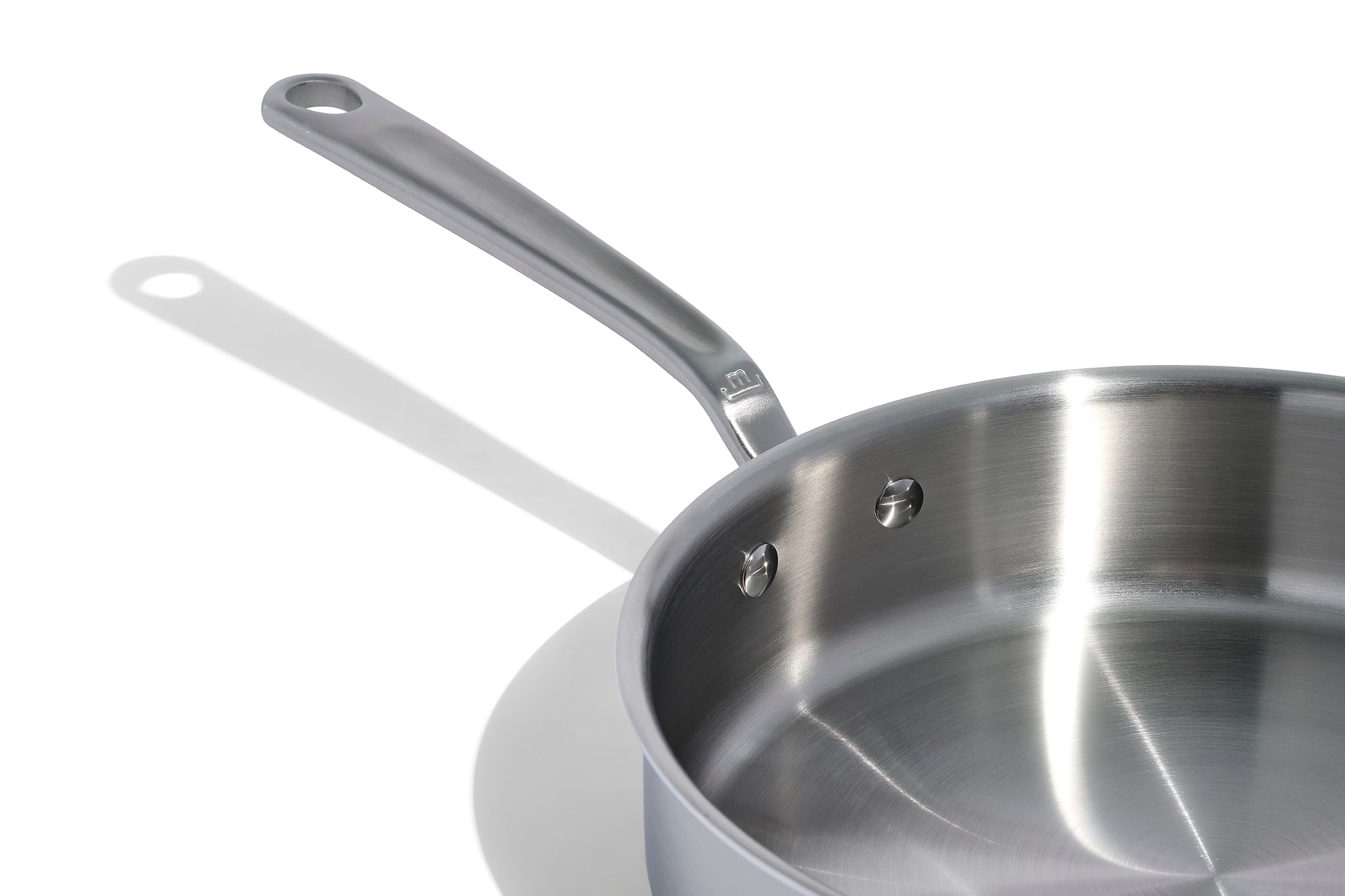 A close up of a Made In Stainless Clad Saute Pan with Lid in front of a white background.