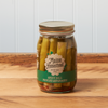 A jar of Maine Homestead Spicy Dill Pickled Asparagus sits on a brown wooden table.