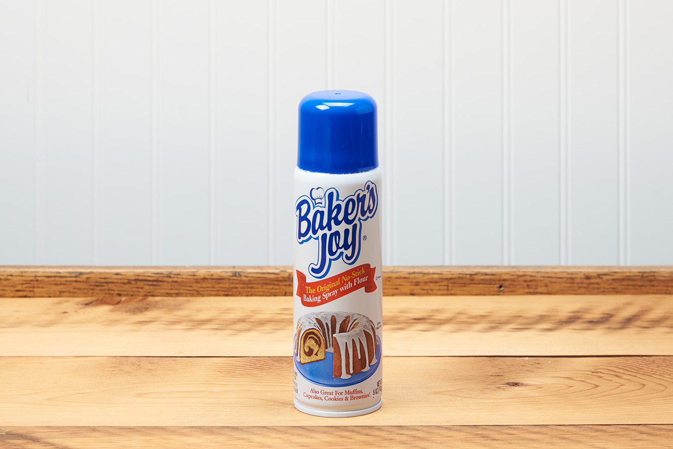 A can of Nordic Ware Baker's Joy Non-Stick Spray sits on a wooden countertop.