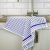 A blue Samuel Lamont	Poli-Dry Towel hangs over a sink.