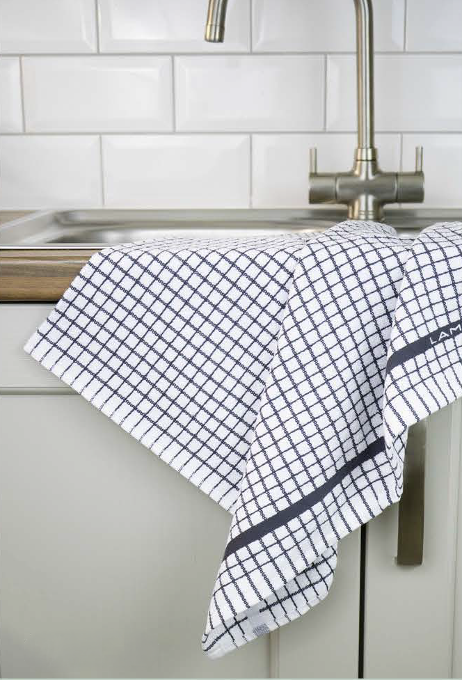 A grey Samuel Lamont Poli-Dry Towel hangs over a sink.