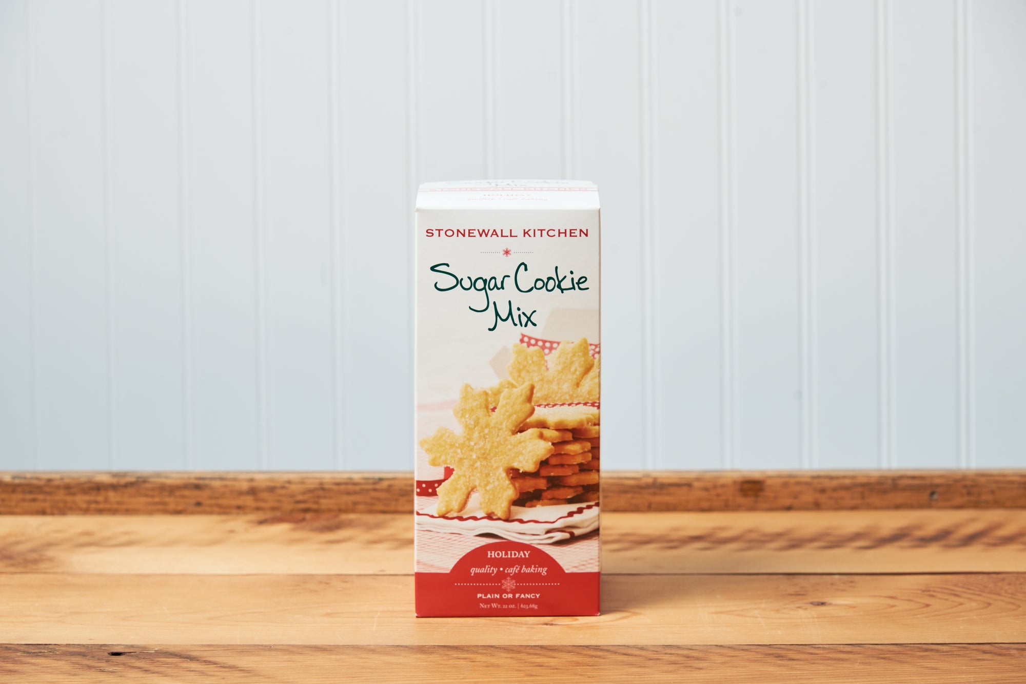 A Stonewall Kitchen Sugar Cookie Baking Mix sits on a wooden tabletop.