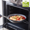 A GreenPan Paris Pro Ceramic Fry Pan is taken out of an oven. The pan is full of a cheesy, sauce-heavy dish. 