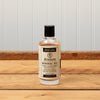 Bottle of JKAdams mineral oil wood conditioner on wooden surface